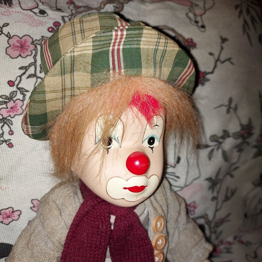 Hobo clown sitting grey green red